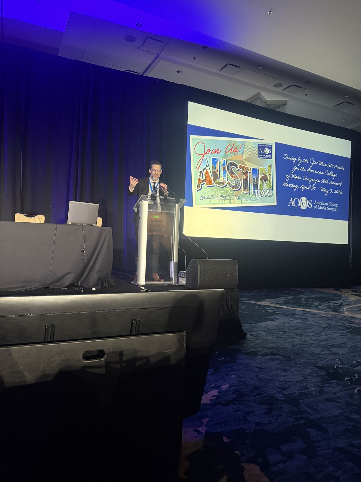 Dr. Kevin Christensen speaking from the stage at the 58th ACMS Annual Meeting in Austin, Texas.